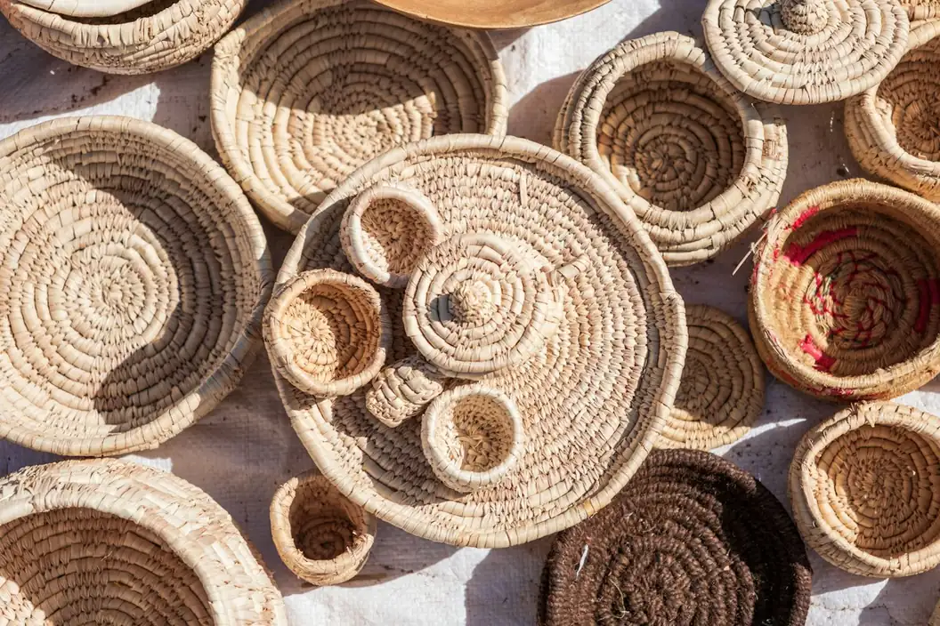 Collection of handmade woven baskets and trays