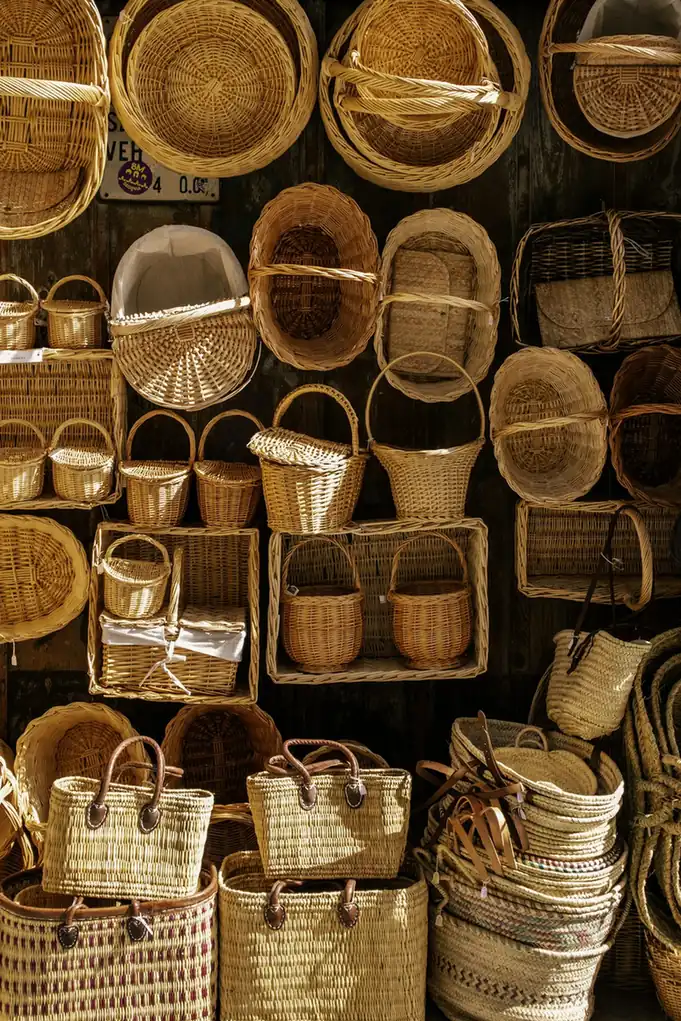 Shop wall full of woven baskets and bags