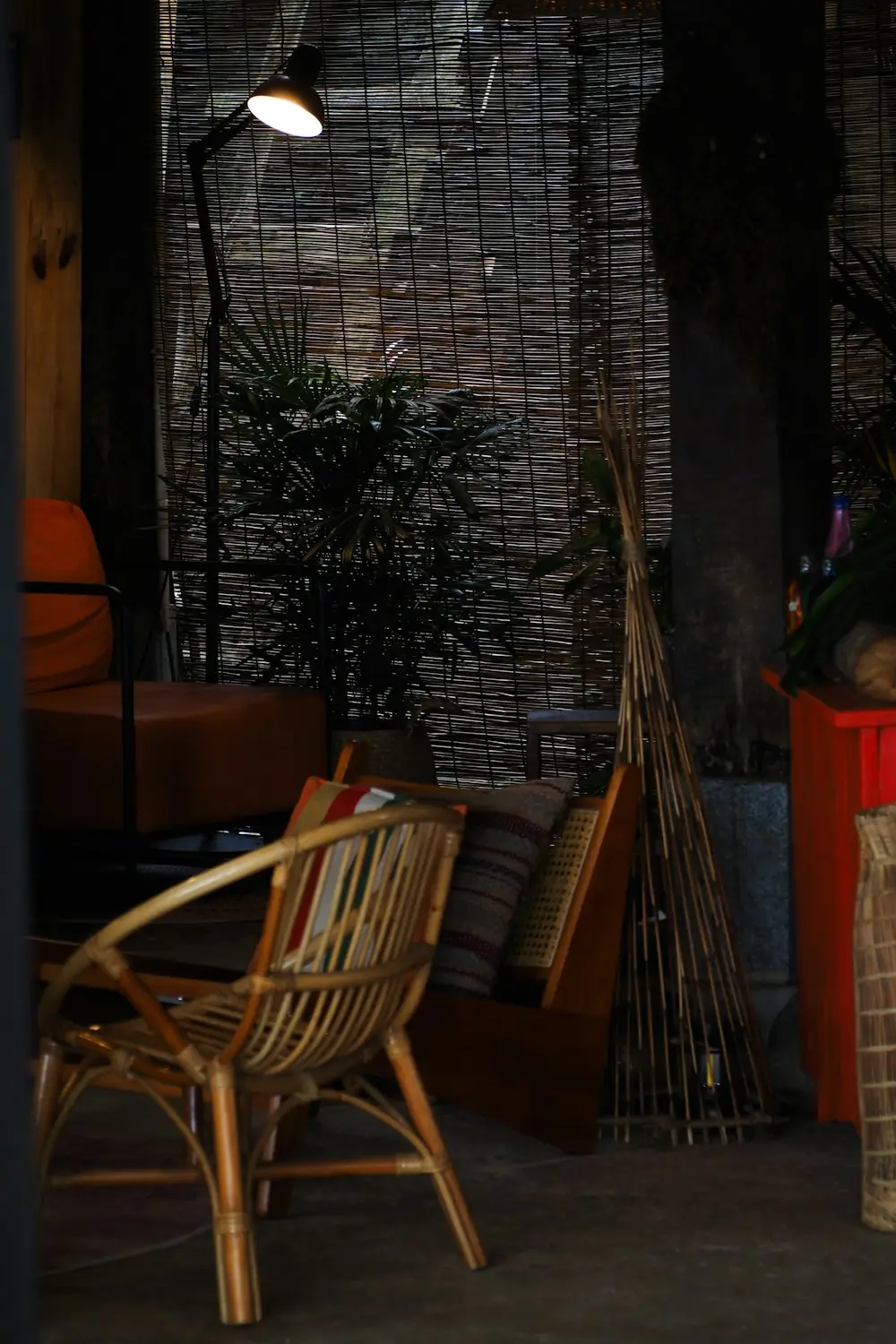 Cosy seating corner with a natural bamboo and rattan chair