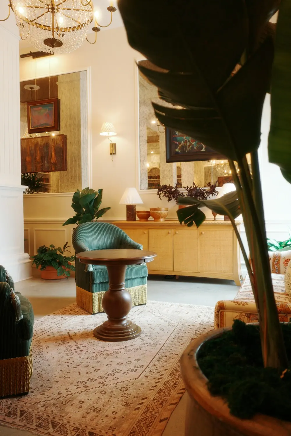 Elegant hotel lobby with vintage furniture and plants